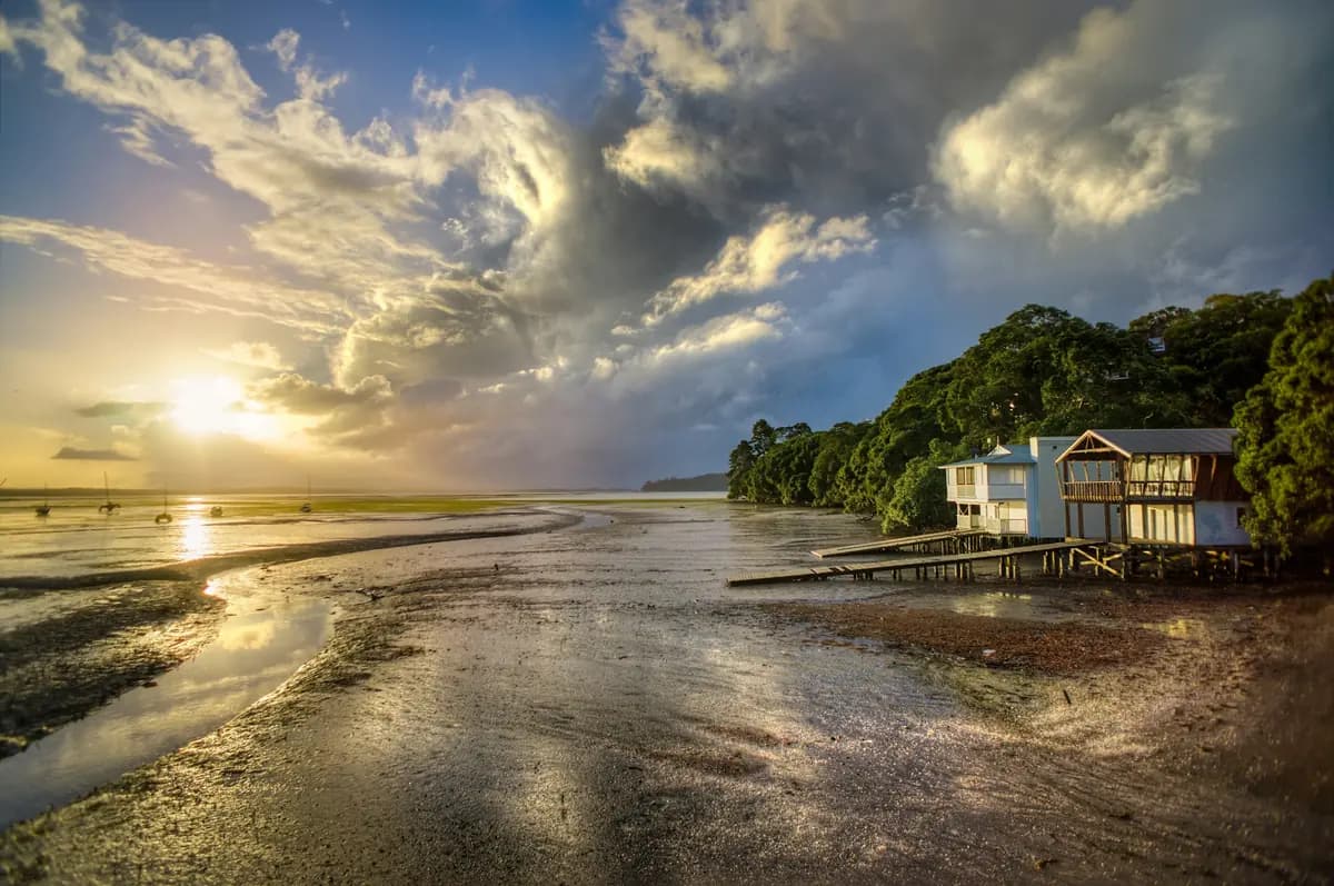 Coastal wooden vacation house near the water at sunrise