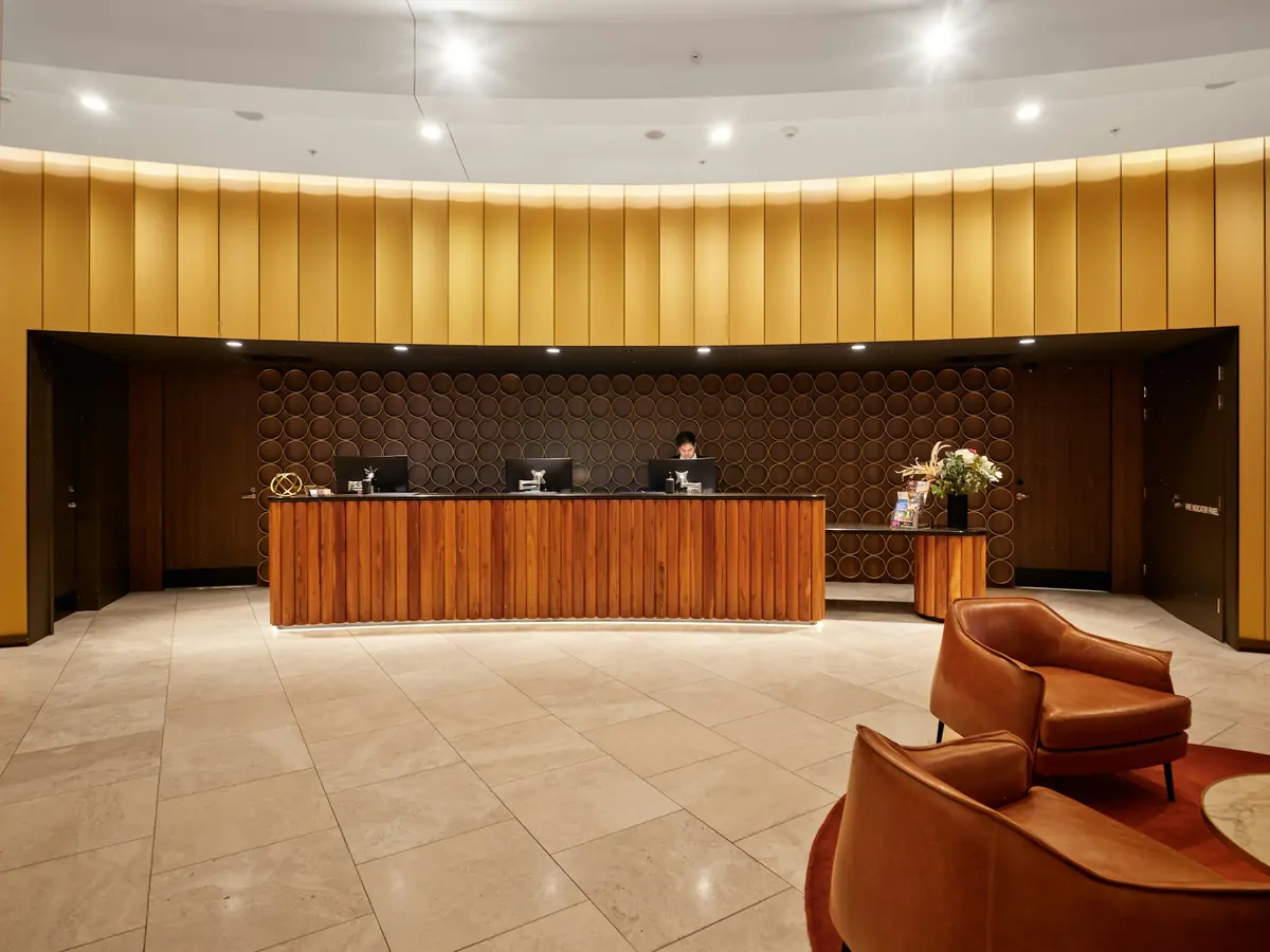 Empty hotel reception desk with modern wooden furniture
